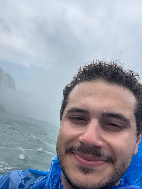 Kadir Lofca in a boat in Niagara Falls.